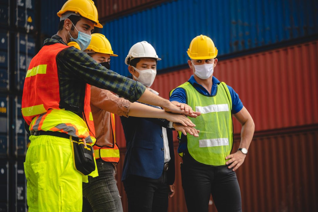 foreman team are working at container yard, logistic cargo warehouse for industrial shipping